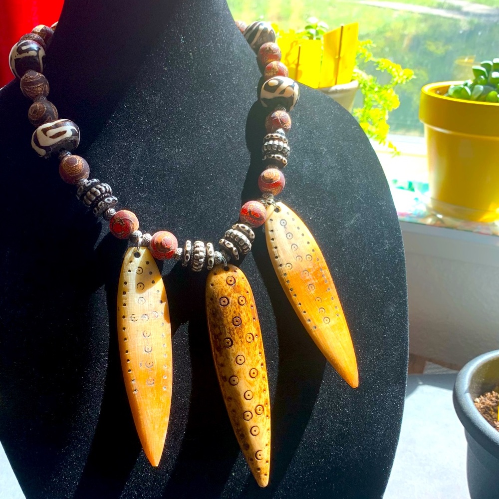 Tibetan Dzi beads, African mud cloth and Bone necklace.